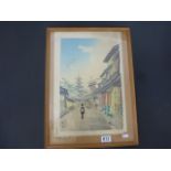 A vintage oriental coloured woodblock print of figures in a street signed to mount.