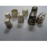 Nine hallmarked silver thimbles