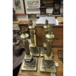 Four brass corinthium style table lamps all on square base