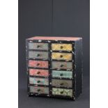 A vintage style small chest of multiple drawers