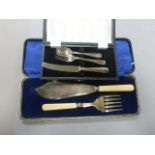 A cased silver plated fish slice and another cased set