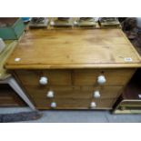 A small Victorian pine chest of two short and two long drawers