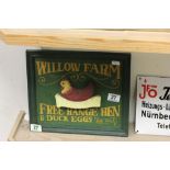 A contempory wooden sign Willow Farm free range eggs .