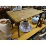 A Victorian pine folding table with turned legs