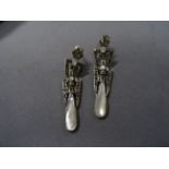A pair of silver, marcasite and moonstone drop earrings