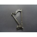 A heavy cast silver harp