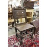 An antique oak 17th century style chair the back support carved with the date 1625 ?.