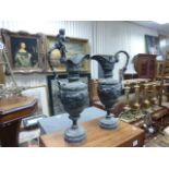 Large pair of copper ornamental urns in Classical style with Cherub decoration