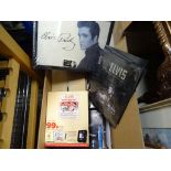 Two boxes of Elvis Memorabilia to include; books, clock, pictures