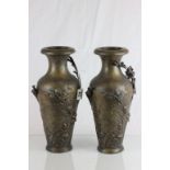 Pair of spelter vases with floral decoration and bronzed effect finish