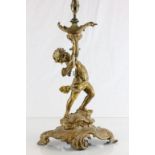 Gilt metal lamp depicting a Cherub lifting an urn