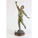 Painted spelter figurine of a Cricketer catching a ball, marked to base G.OMERTH