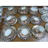 A Royal Crown Derby Imari pattern quantity of cups saucers plates bowls etc