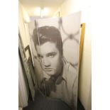 A contemporary threefold screen decorated with an image of Elvis as a young man.