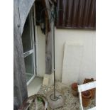 Wrought Iron Bird Feeding Stand with four hanging feeder branches and a re-constituted stone base