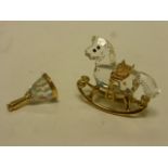 Two boxed Swarovski Crystal Memories items to include; Bell 9460 000 047, Rocking Horse 9460 000