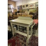 An antique painted washstand with carrara marble top. raised on turned supports.