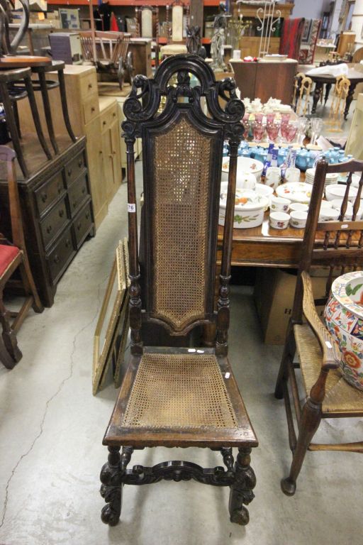 An antique Jacobean oak hall chair of narrow form with rattan seat and back rest . - Image 2 of 3