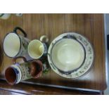 Collection of Torquay Ware to include milk jug, bowls, butter dish etc