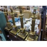 Four Corinthian Column style brass table lamps fitted for electric