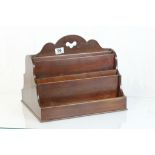 A late 19th century mahogany stationary rack for a partners desk