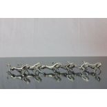 Set of six knife rests in the form of stylised horses