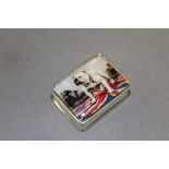 A silver pill box with enamel image of a dog