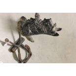 Vintage equestrian cast iron doorstop in the form of a Scottie Dog and a boot pull