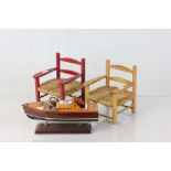 Wooden motor cruiser on stand and Two Chairs