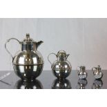 Two silver plated Guernsey cream jugs, a similar pepperette and one other