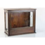 Wooden display cabinet with glazed panels and unusual lift & fold access to the front