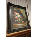 A pierced gilt framed oil painting still life of flowering blooms in a vase on a stone ledge