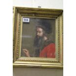 A gilt framed oil painting of a classical man artist