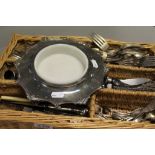 Wicker cutlery tray with a collection of silver plated cutlery