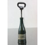 A cold plated bronze corkscrew in the form of a bottle of champagne