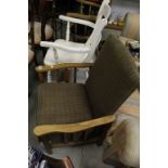 A vintage cottage reclining arm chair