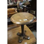 A small oak circular side table