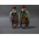 Two inside painted glass snuff bottles decorated with Geisha girls