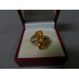 An 18ct yellow gold dress ring set with diamonds, citrines and peridot