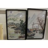 Pair of Oriental framed paintings on fabric figures by mountain landscape.