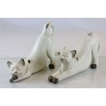 A pair of pottery model cats