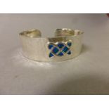 Silver cuff bangle with plique a jour decoration in the Art Nouveau style