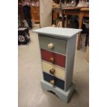 A small painted four drawer chest