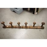 A vintage set of six faux bamboo coat hooks