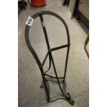 A painted iron saddle/tack stand