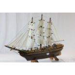 Wooden model of a sailing ship with stand