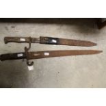 Late 19th/early 20th century bayonet with scabbard and German butcher bayonet with scabbard
