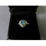 A 9ct white gold heart shaped aquamarine and diamond ring