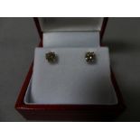 Pair of white gold diamond stud earrings of 77 points exact weight