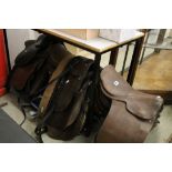 Collection of Equestrian Tack including Nine Leather Saddles, Saddle Straps, Rugs, etc